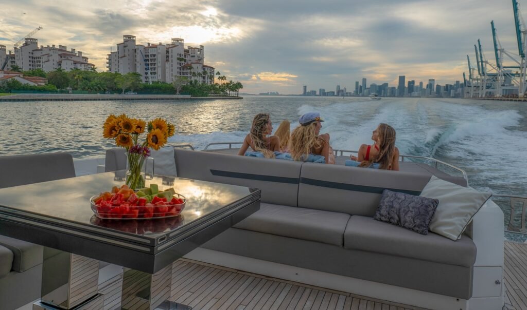 74ft Sunseeker with 3 ladies aboard at sunset - Luxury Charter Miami for Rent