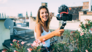 A woman is taking a video with their camera